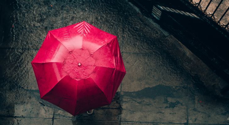 Red Umbrella in Flooding caused by Bad Weather